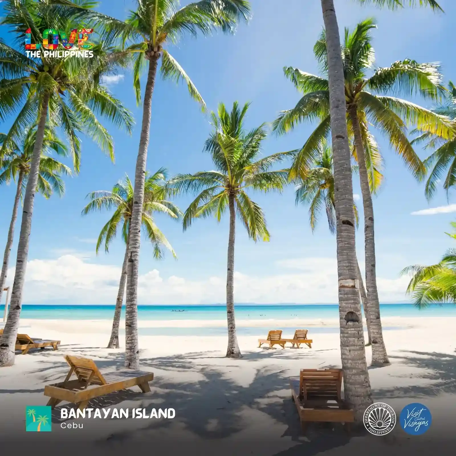 Aerial view of Santa Fe beach on Bantayan Island with white sand and turquoise shallow water at low tide and outrigger bangkas pulled up on the shore